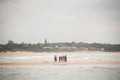 Young people standing in the sea in Punta do Ouro in Mozambique